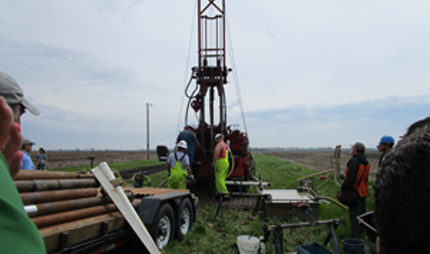 Retrieving a soil core for study using drill