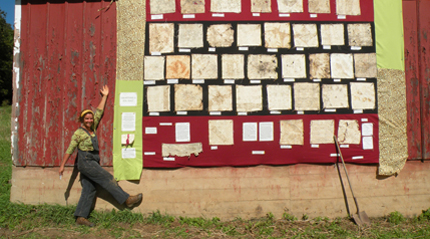 Soil quilt on display with barn