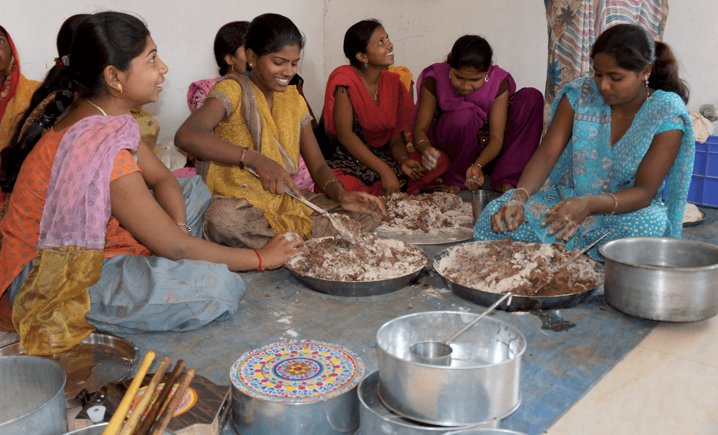 Women in India preparing pappad from the flour of locally produced finger millet. Photo courtesy of Wikimedia Commons/Crops for the Future.