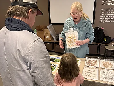 Melanie Bayles and visitors playing the "matching game" during a "Saturday With a Scientist" event. Photo by Susan Chapman.